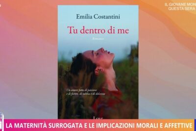 Television image with a book cover and a banner about maternita surrogata 1 showing a woman leaning back in a field