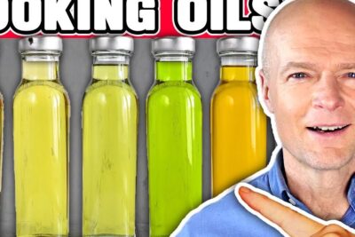 Presenter pointing at a row of colorful cooking oil bottles for mellem konnene 2.