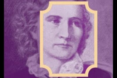 Antique portrait of a woman with curled hair and a lace collar inside a decorative frame, naisten aanioikeuden 1.