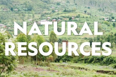 Verdant hillside with trees, terraced farmland and scattered village houses illustrating natural resources 1.
