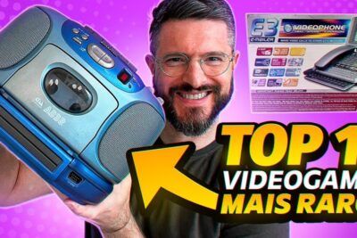 Smiling collector holds a vintage blue gaming console and boxed tech promoting os videogames.