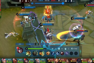Pa odet in-game MOBA team fight showing heroes, abilities, and turret engagement