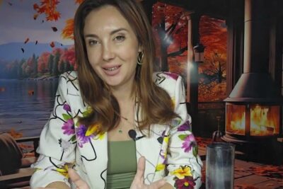 Woman speaking in a cozy autumn lakeside room about paatoksen tekemista and decision-making