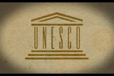 UNESCO emblem printed on textured vintage paper representing patrimonio mundial 1 and world heritage symbolism