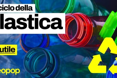 Close-up of multicolored bottle necks and a yellow recycling symbol highlighting plastica materiale