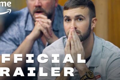 Young man clasping hands anxiously during a screening, evoking a popular jury reaction.