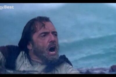 A desperate seafarer gasping and gripping a boat amid rough ocean waves, poseidon ulysse