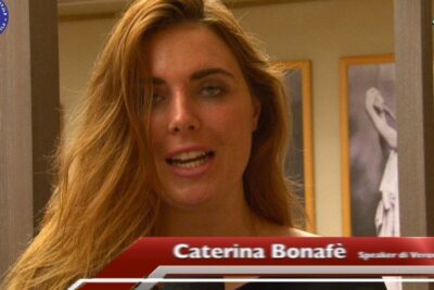 Close-up portrait of a female speaker in an indoor interview setting discussing protezione ambientale 1.