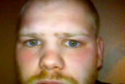 Close-up portrait of a person with short-cropped hair, light stubble, and a direct gaze suitable for psykoanalysen dens.