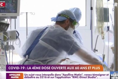 Medical staff in protective gear treating a hospital patient with a news banner referencing quatrieme dose