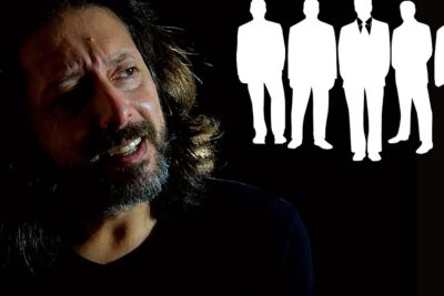 Bearded man in dramatic shadowed portrait beside white business silhouettes representing relazione stabile 1