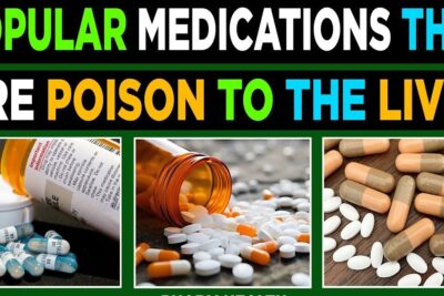 Spilled prescription bottle and assorted capsules and tablets illustrating reseptfrie medisiner that can be harmful to the liver