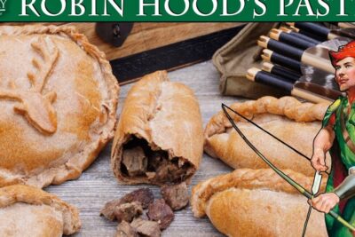 Illustration of Robin Hood with bow beside rustic meat pasties on a wooden table, rettferdig rettergang 1.