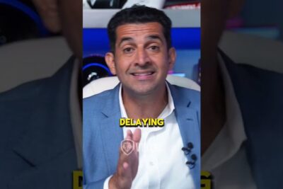 Presenter in a blue blazer gestures toward camera with on-screen text 'DELAYING', illustrating risken for delays.