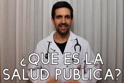 Smiling clinician in a white coat with a stethoscope presenting a public health topic for salud publica 3