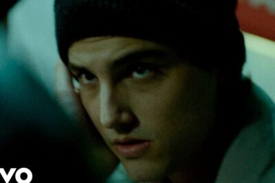 Cinematic close-up of a young man in a beanie with a thoughtful expression for san valentin 2.