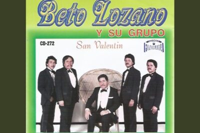 Five men in tuxedos posed around a wicker chair on a vintage album cover, san valentinin 1