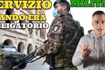 Soldier in camouflage with Italian flag patch and rifle guarding near the Colosseum representing servizio militare 3.