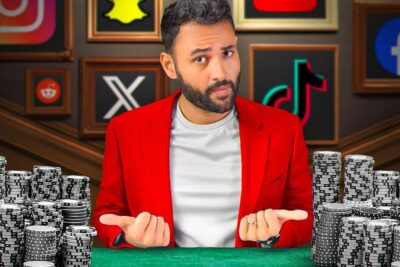 Man in red blazer at poker table with stacks of chips and framed social media logos in the background, social media 29.