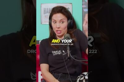A woman wearing headphones speaking into a microphone in a colorful podcast studio, sociala medier 15.