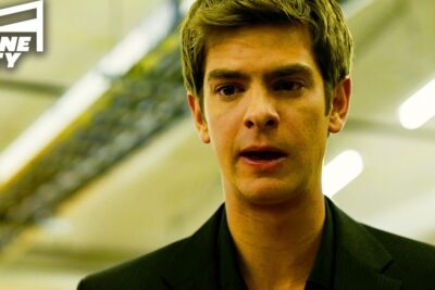 Close-up portrait of a young man in a dark blazer under fluorescent lights suggesting socialt netvark