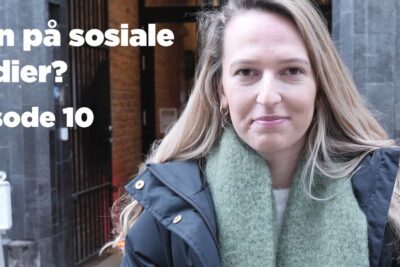 Street portrait of a woman wearing a green scarf and black jacket for sosiale medier 7