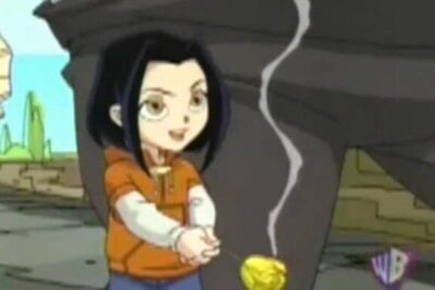 Animated black-haired girl holding a glowing yellow spinning top, evoking spel chans.
