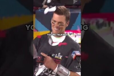 Smiling championship athlete in sport professionale gear celebrating amid confetti and a microphone