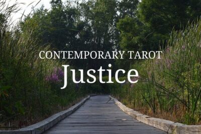 Contemporary tarot justice image of a wooden boardwalk through wetlands.