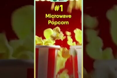 Bursting microwave popcorn in striped tubs illustrating transgene matvarer topics