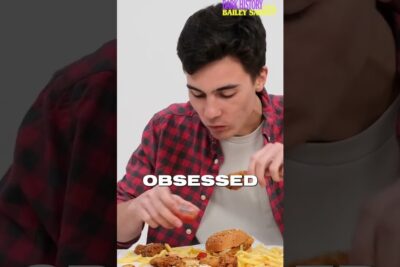 Young man eating a burger and fries, conceptual image for transplantasjon organer and lifestyle discussions.