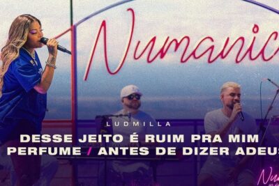 Female singer and male vocalist performing with live band on a rooftop stage under a neon script backdrop, u00e9 importante 2.