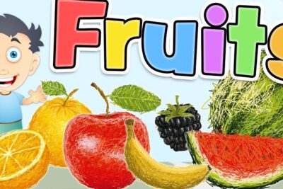Bright cartoon composition showing an apple, banana, orange, watermelon slice, blackberry and a smiling child under the word 'Fruits' for vare tosproget.