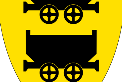 Yellow heraldic shield displaying two black mine carts representing ved gruvedrift.