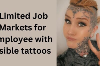 Person with visible tattoos on face and neck flashing a peace sign