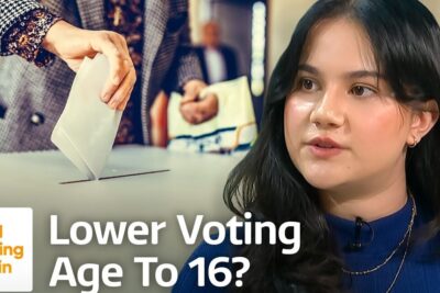 Hand placing a ballot into a ballot box next to a young interviewee discussing voting age 3 and youth suffrage