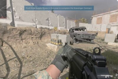 First-person shooter screenshot of a player aiming at supply boxes near a wrecked vehicle in a training yard for windows sonic 8 audio demonstration.