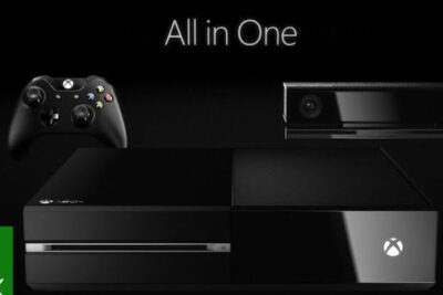 Black xbox one 13 console with wireless controller and Kinect sensor on a dark background.