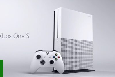 Sleek White Xbox One S Console and Controller — xbox onen 1 Product Shot of a vertical white console paired with a matching wireless controller on a minimal gray backdrop.