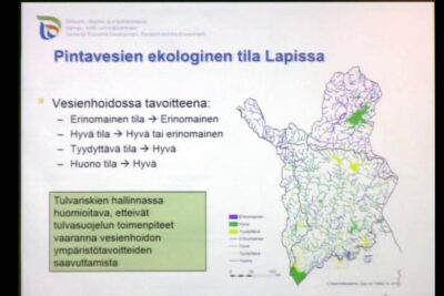 Ecological slide showing a color-coded map of Lapland surface waters, management goals and flood risk note emphasizing ymparistoon luontoon.